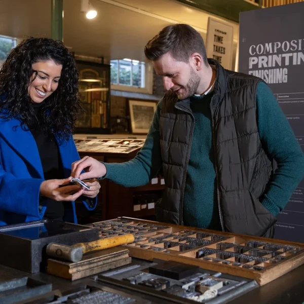 man and woman looking at print tools