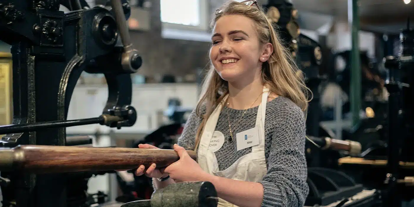 Student using the printer press