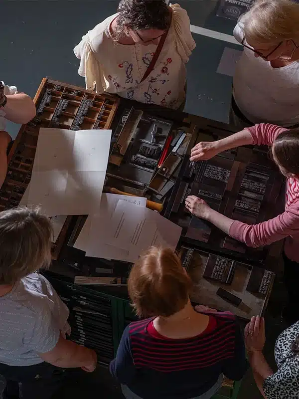 Workshop event in print museum with a group of people