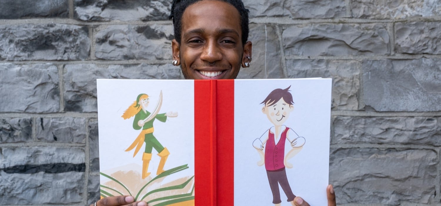 A man displays the letter-press printed covers of the deluxe edition of Blot's Most Marvellous Historical Guide to Printing Books
