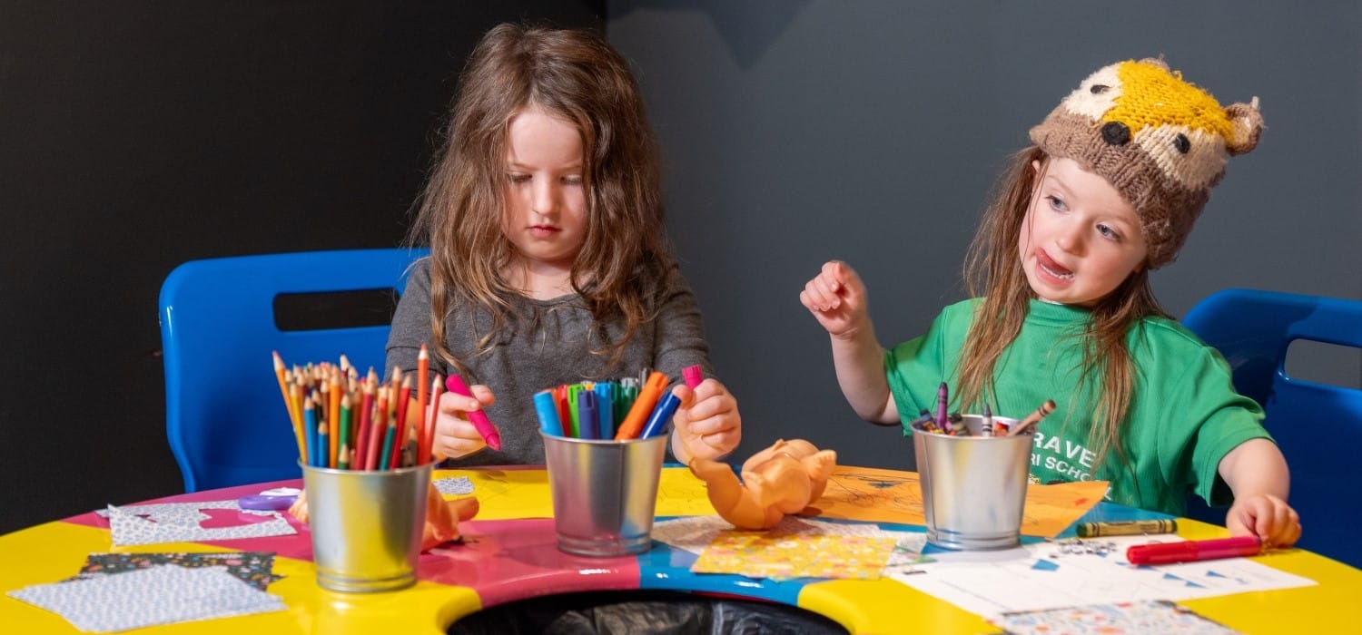 Children making crafts in creative corner