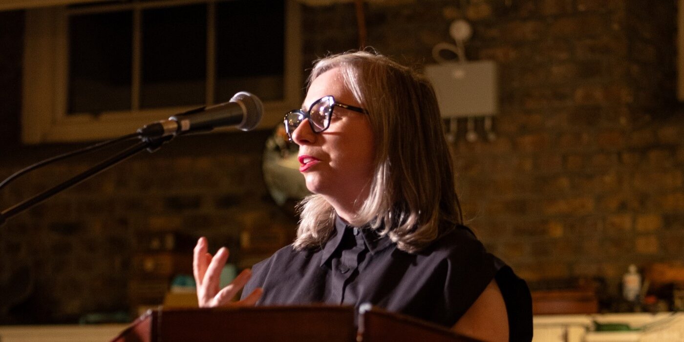 Dr Linda King speaks at the opening of the 'Poster Boys' exhibition