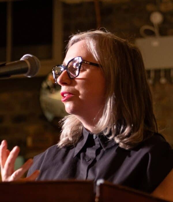 Dr Linda King speaks at the opening of the 'Poster Boys' exhibition