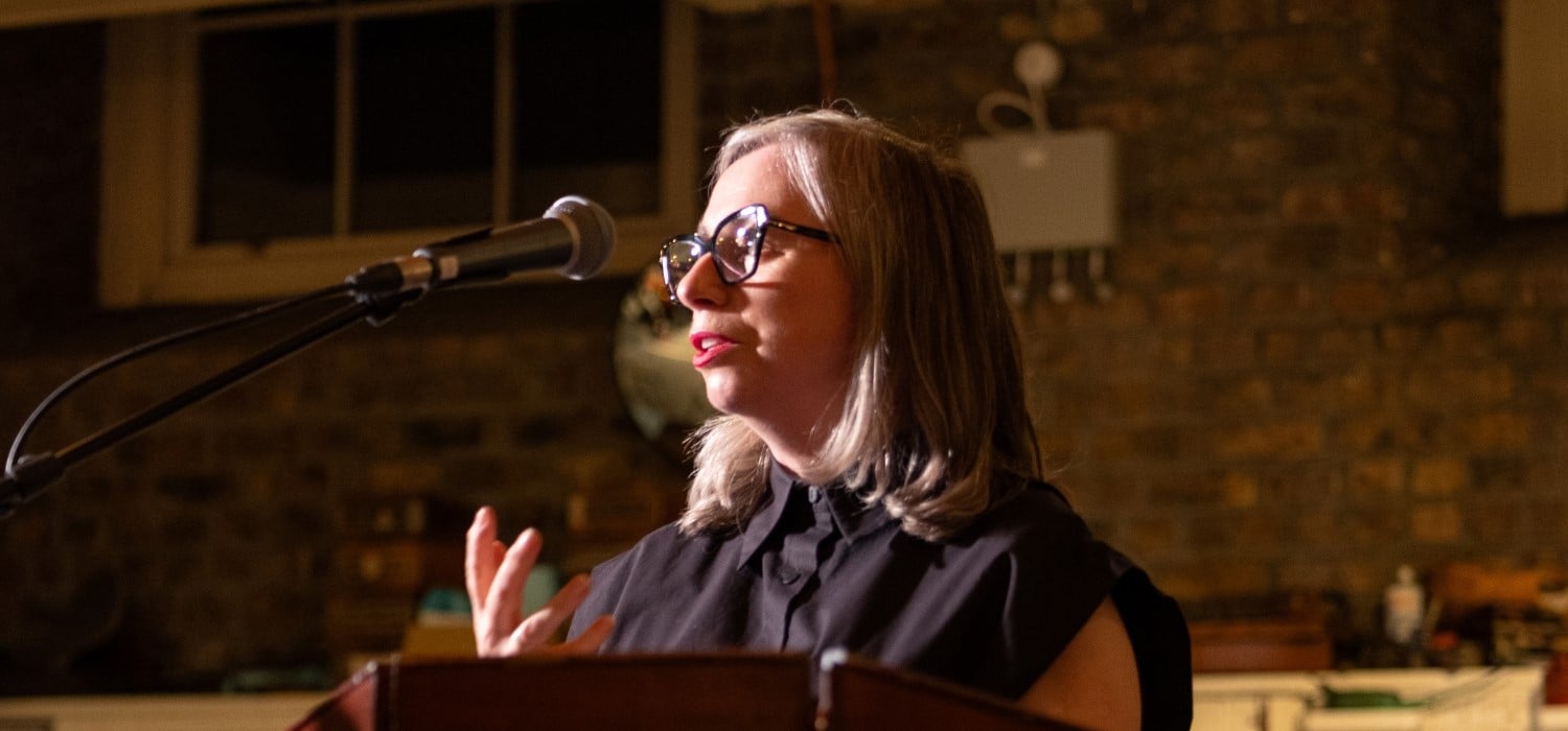 Dr Linda King speaks at the opening of the 'Poster Boys' exhibition