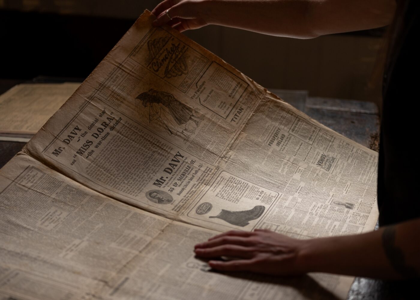 A newspaper showing an advert for Mr Davy, a dentist