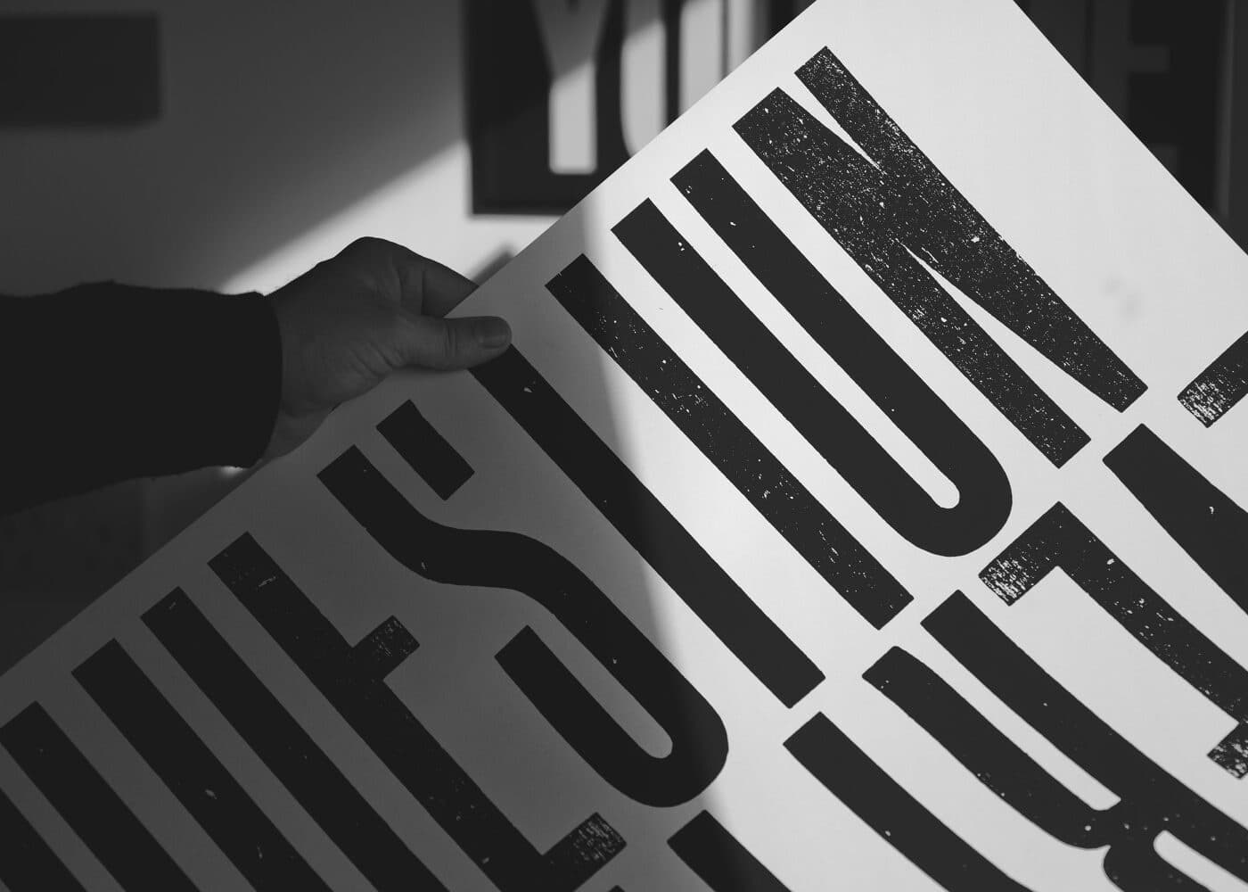 A zoomed in view of large black text printed on white paper