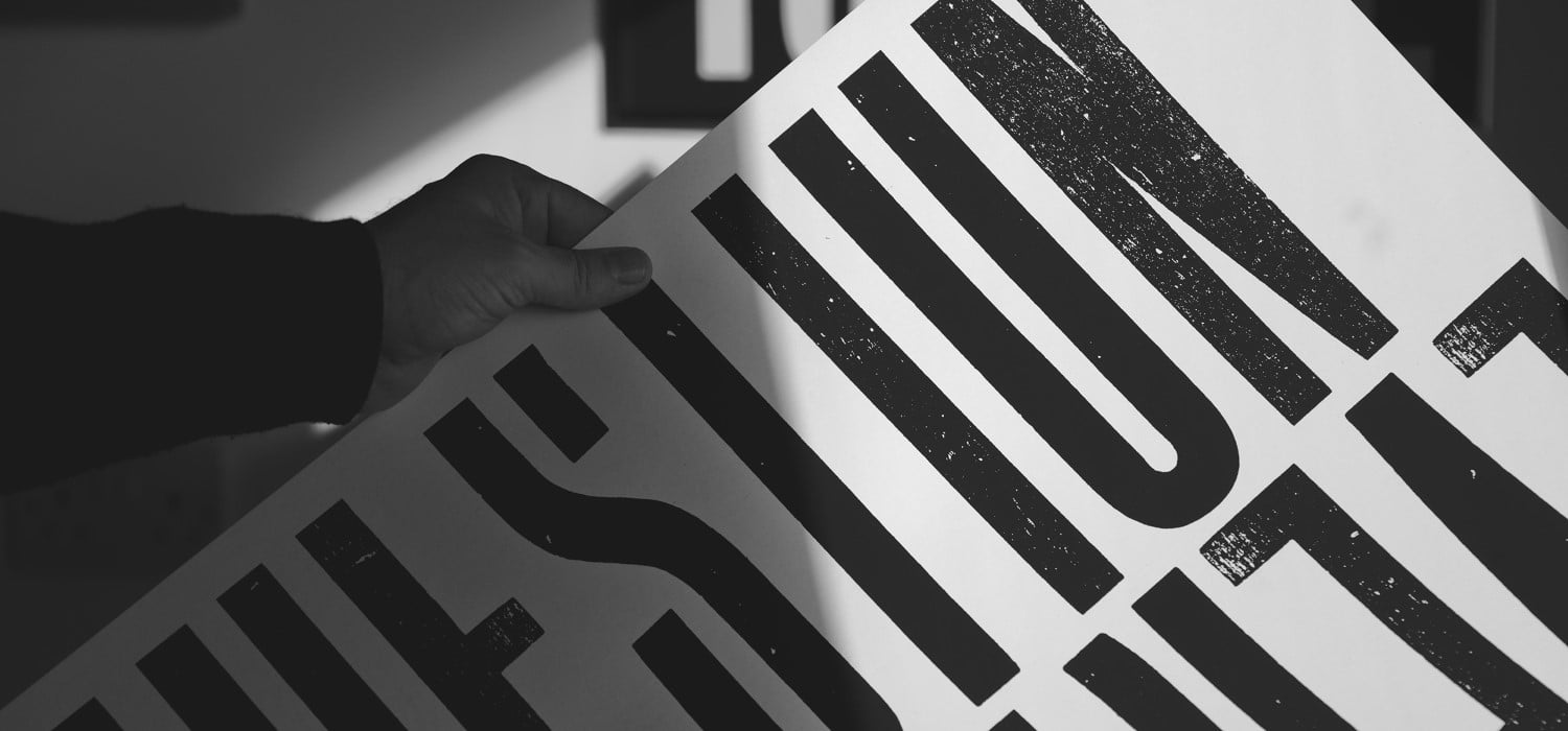 A zoomed in view of large black text printed on white paper