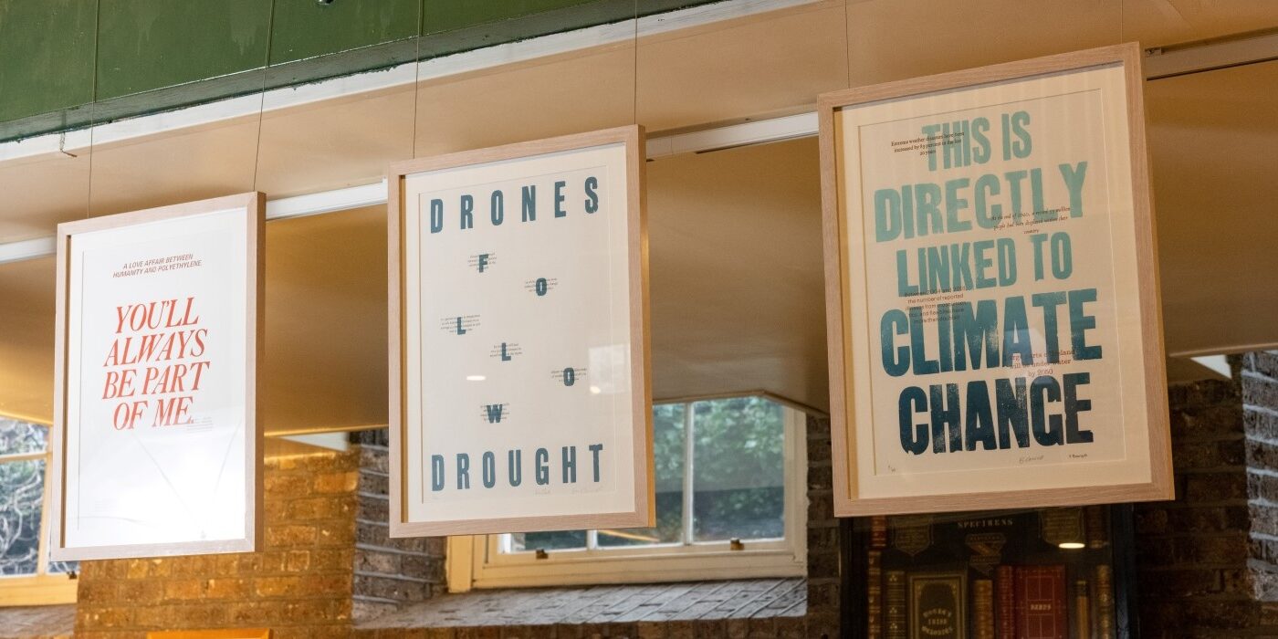 A row of framed letterpress prints using text to comment on climate change
