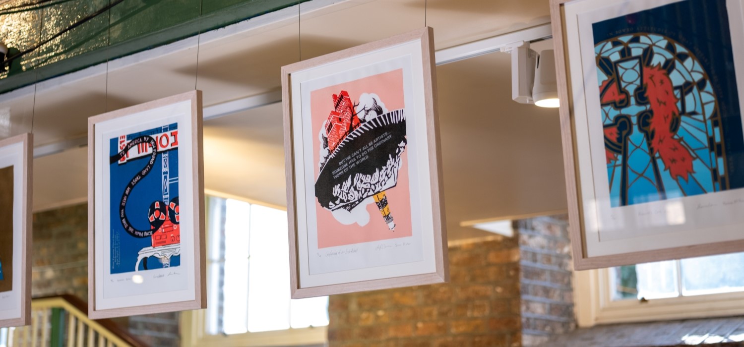 A row of framed prints inspired by plays of Brendan Behan