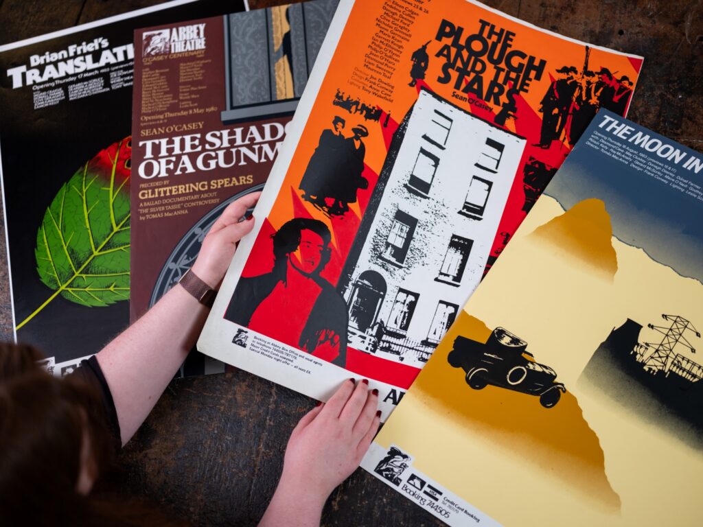 Four Abbey Theatre posters laid out on a table