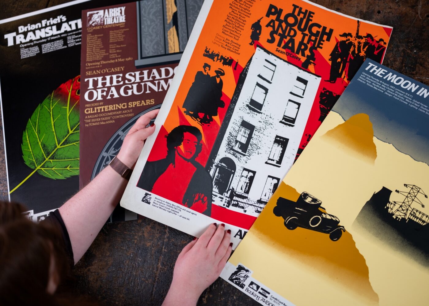 Four Abbey Theatre posters laid out on a table