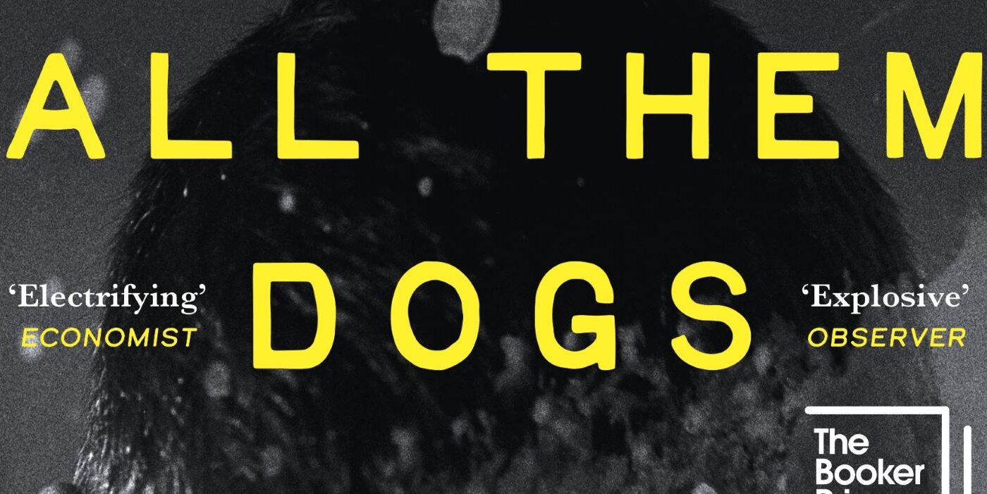 A detail of a book cover reading All Them Dogs in yellow text on a black and white background.