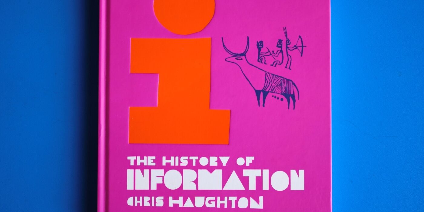 A photograph of the cover of the book The History of Information by Chris Haughton