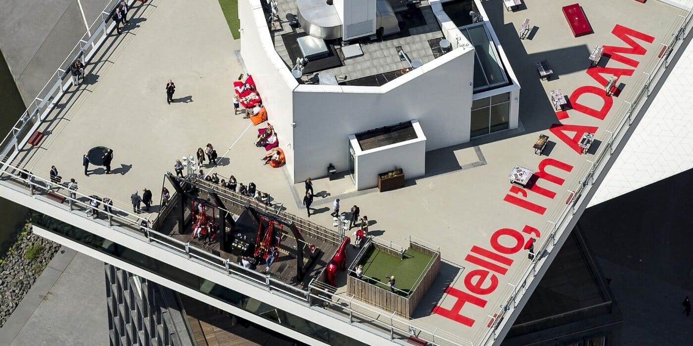 An arial view of the top of a building with large red writing on it.